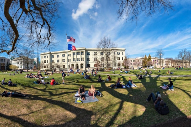Students relaxing on a university lawn in the USA