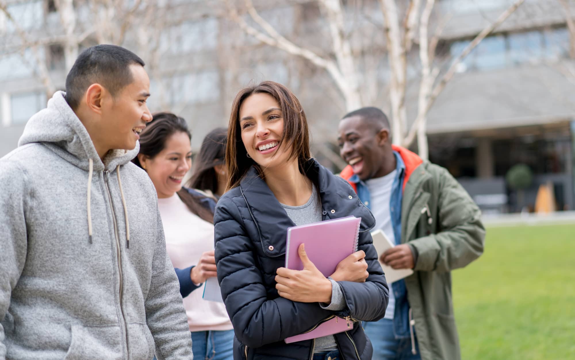 International students smiling together on a university campus